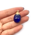 Deep blue teardrop natural stone pendant with gold plated bail held in hand - Dark Blue (No. 3)