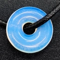 Minimalist light blue opal donut pendant necklace with an adjustable black cord - Opal