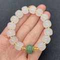 Natural white jade and green aventurine barrel bead bracelet with gold accents on a hand - White And Green Style (No.1) / 9x11mm