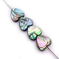 Macro detail of heart-shaped abalone shell beads with natural rainbow iridescent texture - Heart Shape (10mm)