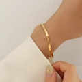 Franse stijl gedraaide armband in 18k verguld roestvrij staal om de pols - Goud