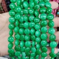 Close-up of green natural stone rondelle beads 12x6mm for DIY jewelry making - 12x6mm / Green Jade