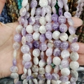 Strand of purple and white flat round natural stone beads held for display - 12x6mm / Purple White Quartz (No. 15)