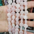 Handheld view of light pink rose quartz flat coin beads for DIY jewelry making - 12x6mm / Rose Quartz