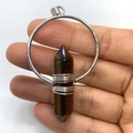 Tiger eye hexagonal crystal pendant wrapped in silver wire within a circular metal frame - 38x61mm / Tiger's Eye