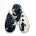Detailed view of teardrop natural stone pendants with gold metal edges and hanging rings - 21x45mm / Style 1 (Dalmatian Jasper)