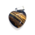 Polished heart-shaped tiger eye stone pendant with a silver-tone metal bail on white back - Tiger's Eye