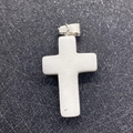 White semi-transparent stone cross pendant with silver bail on textured black base - White Jade
