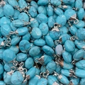 Ovale turquoise hangers met zilveren kapjes voor het zelf maken van sieraden DIY - Blauw Turkoois