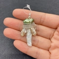 Macro shot of handmade wire wrapped baroque pearl pendant with natural stones craftsmanship - Green Artificial Pearl with Silver-Tone Wire Wrap (No. 2)