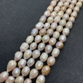 Macro shot of 8-10mm baroque freshwater pearls with natural pink and purple luster - 5-6mm (18g) / Purple