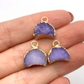 Three purple druzy quartz moon charms with gold-plated edges held in hand - 13x14mm / Purple