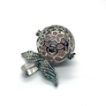 Detailed macro view of silver hollow star pendant cage with pink gemstone bead inside - 29x31mm / Rose Quartz