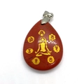 Macro view of red jasper teardrop pendant with gold meditation figure and chakra symbols - Red Jasper (Rainbow Stone)