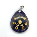Close-up of teardrop purple amethyst pendant with golden yoga meditation engraving - Purple Crystal
