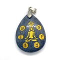 Lapis lazuli teardrop pendant with gold yoga pose and chakra symbols on white surface - Lapis Lazuli