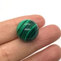 Polished 16mm green malachite round bead held by hand for jewelry DIY accessories - Malachite