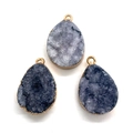 Macro shot of three teardrop-shaped natural crystal pendants with elegant gold metal edging - Gray Blue Style (10)