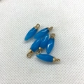 Set of six blue bullet-shaped gemstone pendants with golden metal loops for DIY jewelry - Design No.12