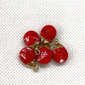 Detail of five faceted red turquoise water drop pendants with gold plated caps for DIY jewelry - Red Turquoise Gold