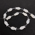 White mother of pearl fish shaped beads for DIY jewelry making on black background - Fish Shape / 8x17mm