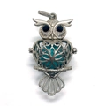 Macro detail of owl cage pendant with green stone bead and black gem eyes - 29x50mm / Blue Turquoise
