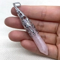 Pink crystal hexagonal prism pendant with silver filigree cap held in hand - 10x78mm / Rose Quartz