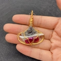 Macro detail of handmade wire-wrapped baroque pearl pendant with natural stone crystals - Style 4 (Three Layer Colored Pearl)