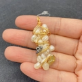 Detail of handcrafted wire-wrapped baroque pearl pendant with golden irregular wire wrap - Mixed Baroque Pearl Gold Wire Style (No. 6)