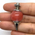 Handheld red carnelian stone pendulum pendant with silver-tone metal cone base - 18x41mm / Watermelon Quartz