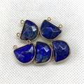 Close-up of five semi-circle lapis lazuli pendants with gold metal frames on white mesh - 17x18mm / Lapis Lazuli