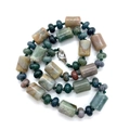 Macro detail of natural stone beads with forest green and mossy green mineral textures - India Agate