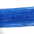 Macro detail of bright blue faceted opal round beads for DIY jewelry making - 2mm / Blue