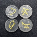 Set of four transparent natural crystals with engraved golden mystical sigils and symbols - White Crystal