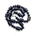 Polished black onyx beaded necklace with cylindrical stones and silver lobster clasp - Black Agate
