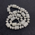 Polished white howlite stone beads strand with gray veins and silver clasp closure - Howlite