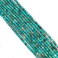 Macro view of cylindrical imperial jasper beads in vibrant teal and green textures - Teal Mottled (No.8)