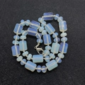 Necklace with cylindrical milky white opal beads and a silver lobster clasp closure - Opal