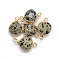 Macro detail of faceted dalmatian jasper teardrop pendants with gold metal frames - Dalmatian Jasper