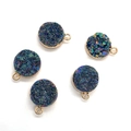 Macro shot of five round rainbow iridescent crystal pendants with gold plated metal edges - Magic Color (No.3)