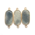 Detail of oval natural stone connector charms with gold plating and gray mineral patterns - Gray Blue Series