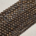 Macro detail of natural brown wooden beads showing unique textures for DIY jewelry making - Bronze Gray / 4mm