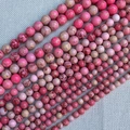 Macro shot of assorted sizes pink imperial jasper round beads for DIY jewelry making - Pink Imperial Turquoise