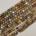 Close-up of natural round agate stone beads with unique striped textures for DIY jewelry - Crazy Agate / 4mm