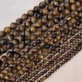 Macrodetail van tijgeroogstenen kralen in verschillende maten met zijdeglans en chatoyance - Tijgeroog (4mm)