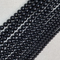 Macro-opname van gepolijste zwarte obsidiaan ronde kralen in diverse maten voor DIY sieraden - Obsidiaan (4mm)