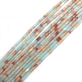Makroaufnahme von 2x4mm zylindrischen Natursteinperlen mit blauen und orangen Mustern - 2x4mm / Hellblaugrün (Nr.9)