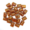 Amber translucent resin rune stones set with engraved gold Norse alphabet symbols - Faux Red Agate