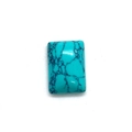 Vue macro d'un cabochon rectangulaire en turquoise poli avec veines noires naturelles - 10x14mm / Turquoise Bleue