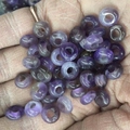 Hand holding polished purple stone abacus beads 4x10mm for DIY jewelry making - 4x10mm / Purple Crystal